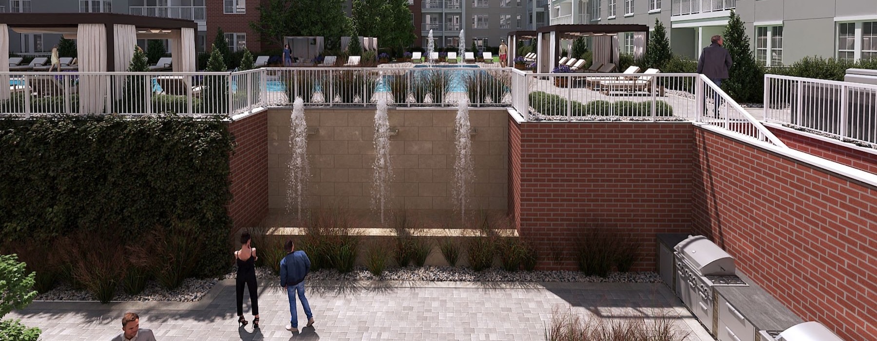 people walking by a wall with a waterfall