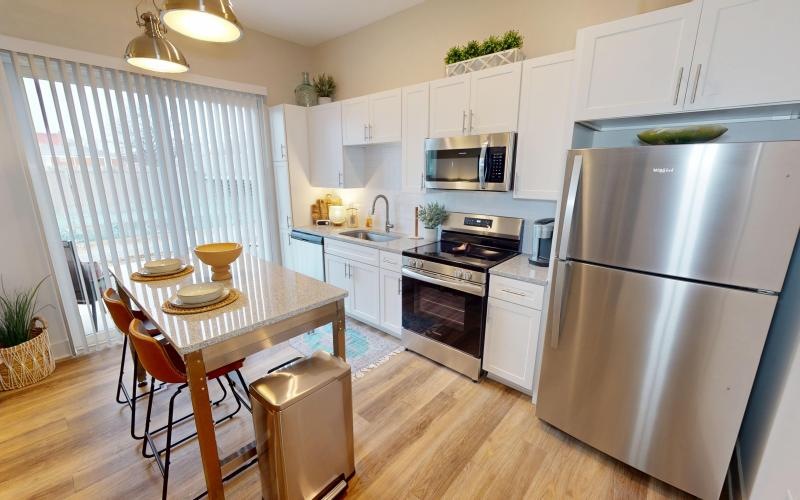 a kitchen with an island and stools