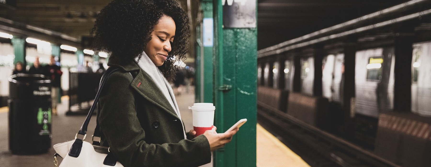 a woman looking at a cell phone