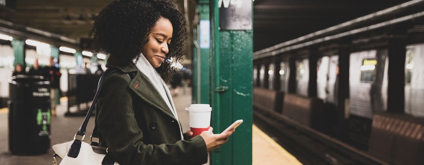 a woman looking at a cell phone